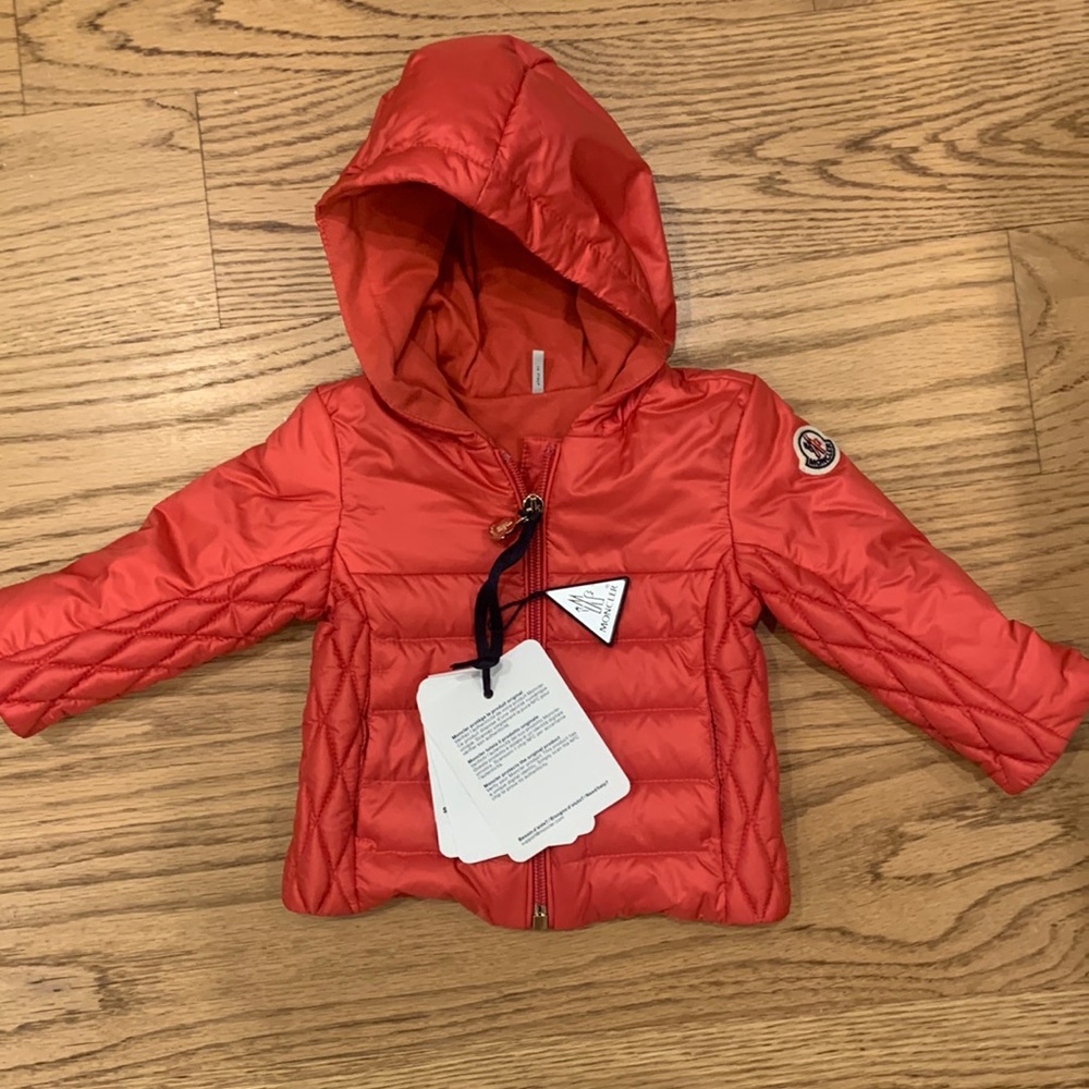 Brand new, still with tags. Moncler hooded red baby jacket.